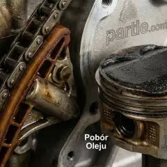 Silnik 1.8 TFSI z widocznym rozrządem i tłokiem z nagarem, wskazującym na pobór oleju.