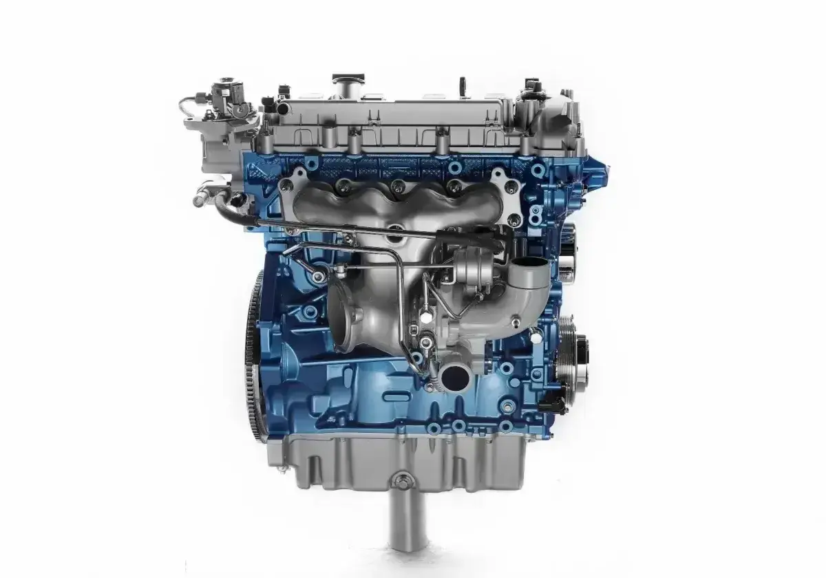 Silnik 1.9 TDI ARL z turbosprężarką, błyszczący niebieski blok silnika i srebrne elementy.
